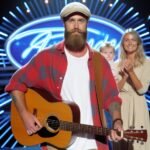 Dylan Wright entering on Stage of Australian Idol with his guitar and his daughter